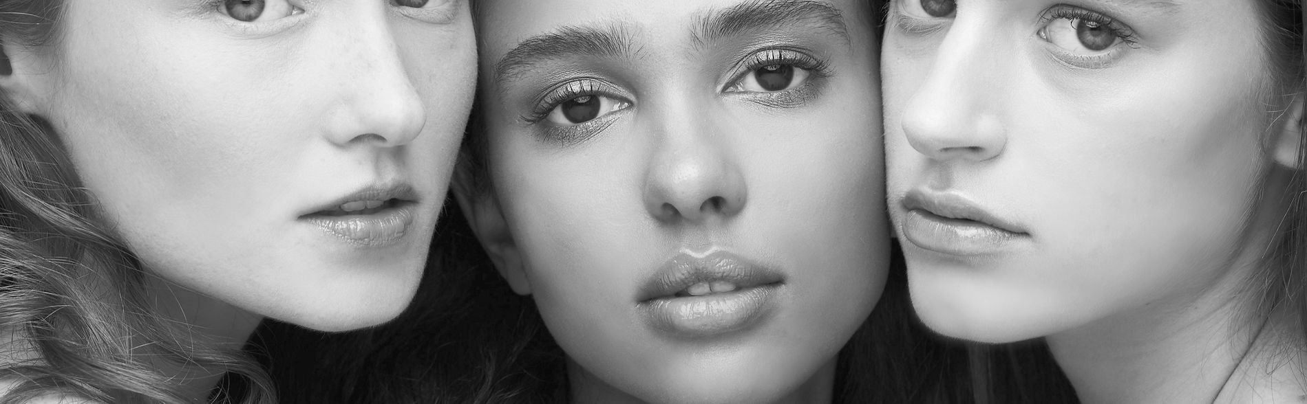 Black and white close-up photo of 3 women of different ethnicities
